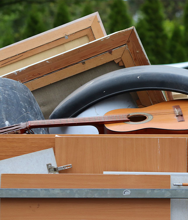 Waste wood from discarded furniture ready for recycling